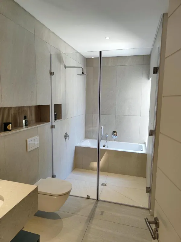 Bathroom renovation with frameless glass shower and built-in bath, Stilbaai